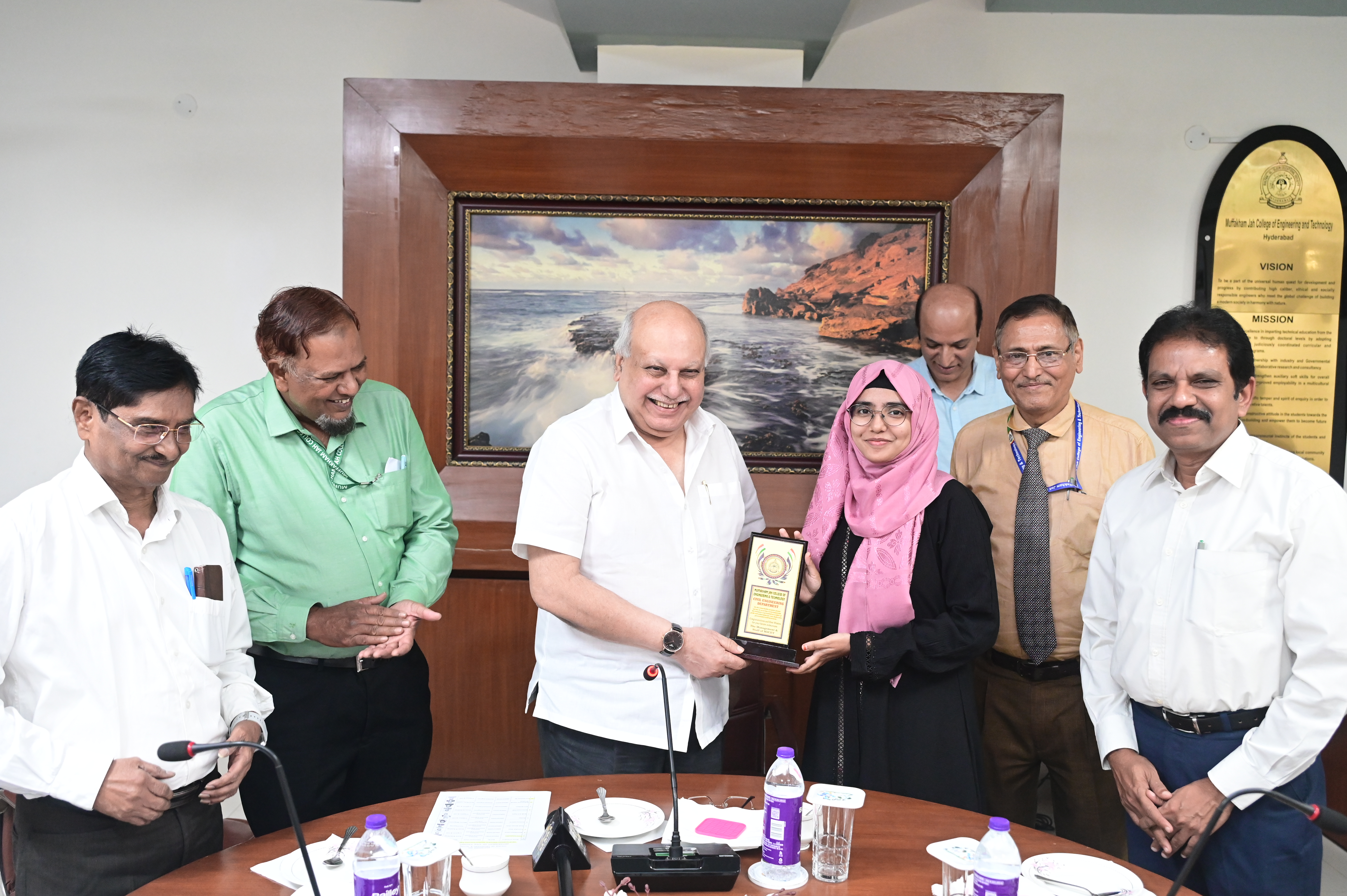 Ms. Ameena Sultana, AEE receiving memento from Hon. Secretary Janab Zafar Javeed, SUES